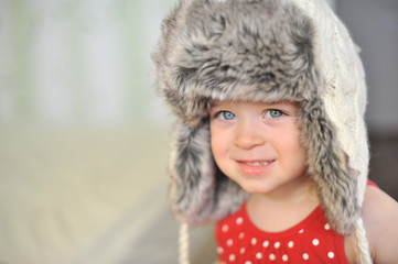 baby with blue eyes in the cap