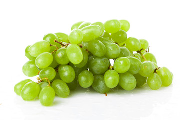 Fresh green grapes on white background