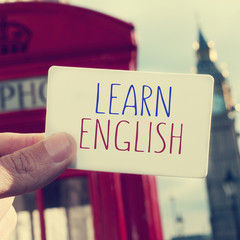text learn english in a signboard with the Big Ben in the backgr