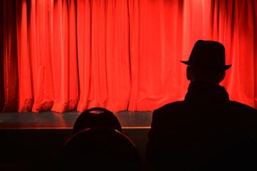 Red Curtain and a Men - obrazy, fototapety, plakaty