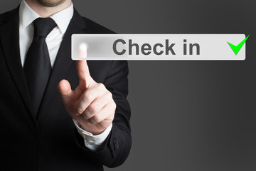 businessman pressing button check in
