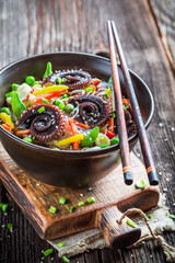 Octopus with vegetables and noodles