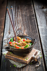 Chicken with sesame with vegetables and noodles