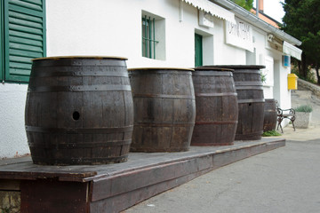 Wooden Barrels In Front Of Pub