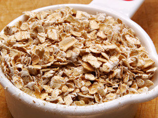 Uncooked oatmeal in a scoop