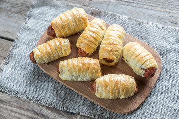 Bowl with sausage rolls