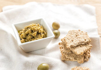 Wholegrain crackers with olive tapenade