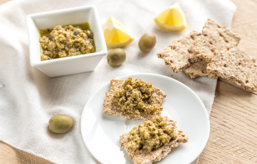 Wholegrain crackers with olive tapenade