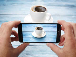 Taking photos with mobile phone.