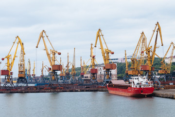 Fototapeta na wymiar Lifting cranes at the port