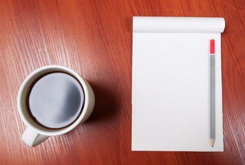 Obraz na płótnie Canvas Blank Pad of Paper, Pen and Coffee