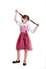 Mädchen im Dirndl spielt mit Zöpfen und hat Spaß Porträt