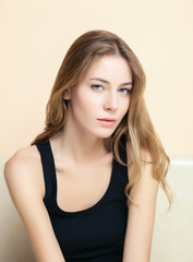 Indoor portrait of young beautiful fashionable woman