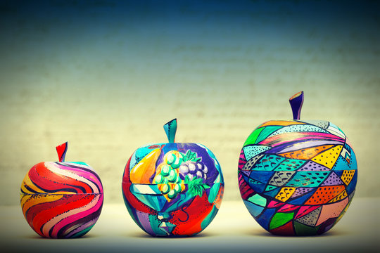 Naklejka Wooden apples painted by hand. Handmade, contemporary art