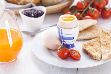 Fototapeta na wymiar English breakfast on white wooden table