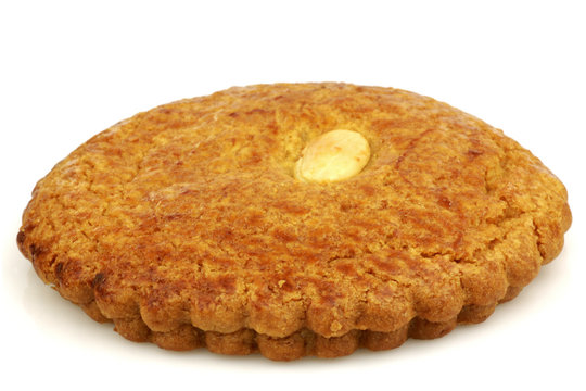 Dutch traditional pastry called"gevulde koek" on a white backgro