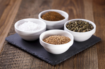 Aromatic spices in white bowls