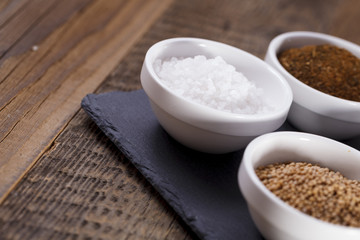 Aromatic spices in white bowls