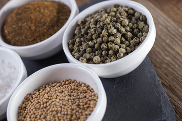 Aromatic spices in white bowls
