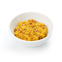 Closeup of french mustard in white bowl