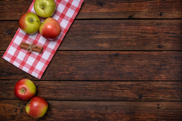 fresh apples with cinnamon on wooden table copy space