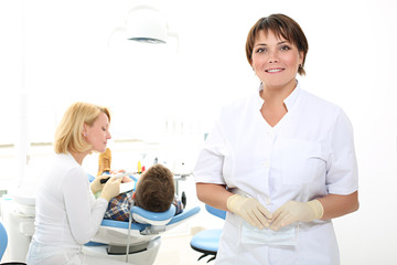 Naklejka premium woman dentist in the dental office