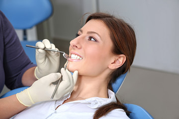 examination of the teeth in the office of the dentist