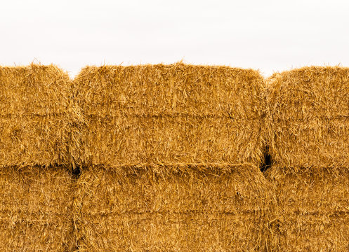 Close-up of yellow stacked hay bales