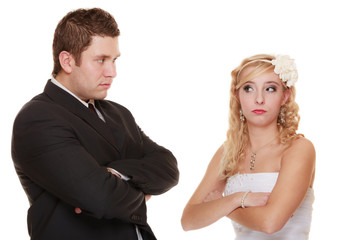 bride and groom looking at each other offended