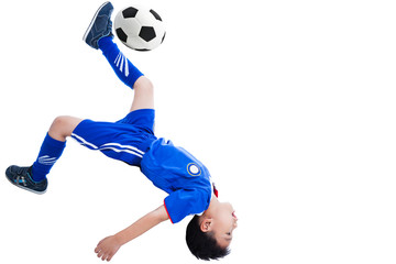 Fototapeta na wymiar Youth soccer player kicking the ball