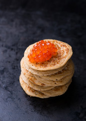 Buckwheat blini with red caviar and sour cream