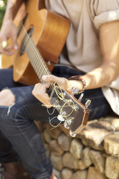 Male playing guitar