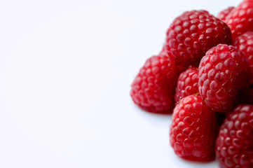 Raspberry white background with left side negative space.