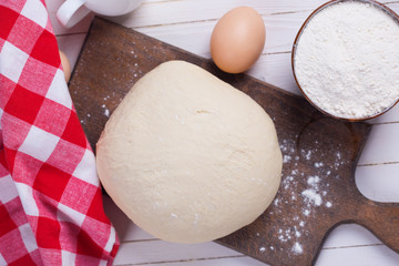 Dough on wooden board