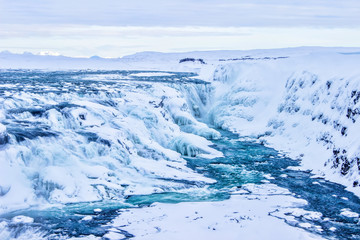 Beautiful winter waterfall background in Iceland