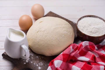 Dough on wooden board