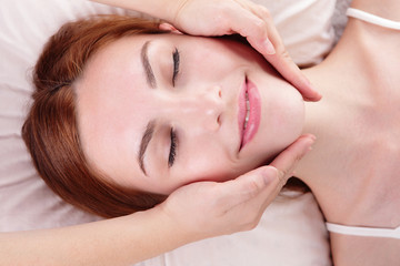 Fototapeta na wymiar young woman enjoy face massage