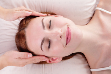 Obraz na płótnie Canvas young woman enjoy face massage