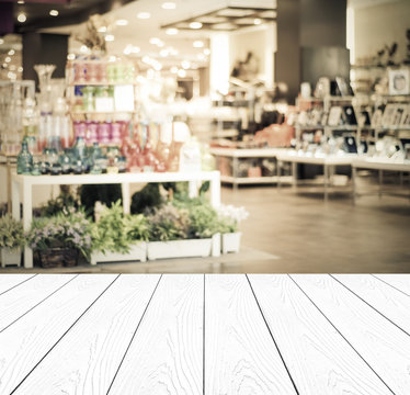 White wood perspective and blurred store with bokeh background