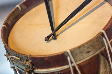 old military drum with black sticks