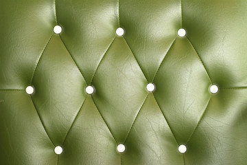 texture of vintage green leather sofa for background