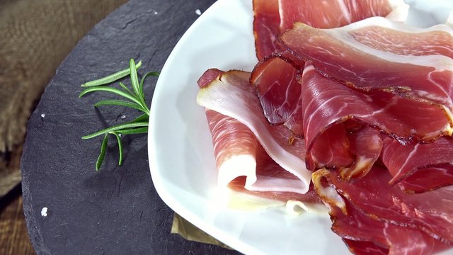 Portion of rotating Sliced Ham (seamless loopable 4K footage)