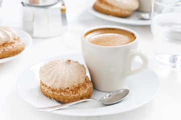 cup of fresh espresso and cakes for breakfast