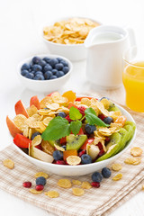 delicious fruit and berry salad for breakfast, vertical