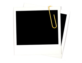 Two blank polaroid style photo frame prints with yellow paperclip isolated on white background