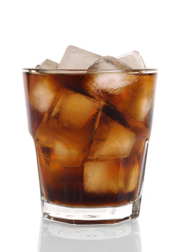 Glass of cold fizzy cola with ice cubes isolated on white background photo