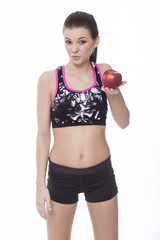 Healthy sporty girl with red apple