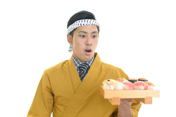驚いた表情の寿司職人