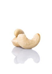 Raw cashew nuts over white background