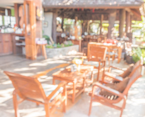 Coffee shop blur background with bokeh image .